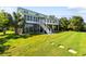 Large backyard with stepping stones leading to house with elevated deck at 2363 Palmer Creek Bnd, Charleston, SC 29412