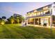Expansive backyard with a neatly kept lawn, well-lit patio, and a view of the home's outdoor amenities at 2363 Palmer Creek Bnd, Charleston, SC 29412