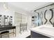 Bright bathroom featuring double sinks, black vanity, black and white backsplash, and makeup vanity at 2363 Palmer Creek Bnd, Charleston, SC 29412