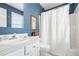 Bathroom featuring a single sink, white vanity, blue walls, and a shower with a white curtain at 2363 Palmer Creek Bnd, Charleston, SC 29412