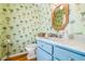 Charming powder room with palm tree wallpaper, and quartz vanity at 2363 Palmer Creek Bnd, Charleston, SC 29412