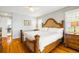 Main bedroom with hardwood floors, ceiling fan, and natural light at 2363 Palmer Creek Bnd, Charleston, SC 29412