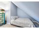 Cozy bedroom with sloped ceilings and modern gray and white patterned comforter at 2363 Palmer Creek Bnd, Charleston, SC 29412