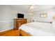 Bedroom featuring hardwood floors, a ceiling fan, and a wooden dresser with a TV on top at 2363 Palmer Creek Bnd, Charleston, SC 29412