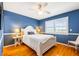 Bedroom featuring a white bed frame, blue walls, and white window shutters at 2363 Palmer Creek Bnd, Charleston, SC 29412