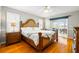 A Primary bedroom has hardwood floors, a ceiling fan, and a king bed at 2363 Palmer Creek Bnd, Charleston, SC 29412