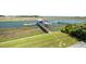 Backyard dock and waterway with kayak and American flag at 2363 Palmer Creek Bnd, Charleston, SC 29412