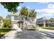 Charming beach house with dual staircases and palm trees at 2363 Palmer Creek Bnd, Charleston, SC 29412