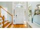 Inviting foyer with wood floors, a staircase, and views to outside at 2363 Palmer Creek Bnd, Charleston, SC 29412