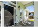 Inviting front porch with rocking chair and decorative door at 2363 Palmer Creek Bnd, Charleston, SC 29412