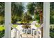 Beautifully landscaped front yard with palm trees and circular driveway at 2363 Palmer Creek Bnd, Charleston, SC 29412