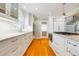 A full view of the kitchen with stainless appliances, marble countertops, and hardwood floors at 2363 Palmer Creek Bnd, Charleston, SC 29412