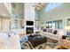 Bright and airy living room with vaulted ceilings, a fireplace, and built-in shelving at 2363 Palmer Creek Bnd, Charleston, SC 29412