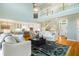 Spacious open-concept living area with abundant natural light, hardwood floors and modern decor at 2363 Palmer Creek Bnd, Charleston, SC 29412