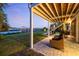 Inviting outdoor patio area with a cozy seating area, view of the backyard and a private dock on the water at 2363 Palmer Creek Bnd, Charleston, SC 29412