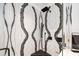 Close-up of a glass shower with black hardware and black and white patterned backsplash at 2363 Palmer Creek Bnd, Charleston, SC 29412