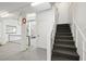Stairwell in the basement with carpet steps, great lighting, and convenient access to other areas at 2363 Palmer Creek Bnd, Charleston, SC 29412