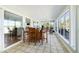 A sunroom with tiled floors and walls of windows at 2363 Palmer Creek Bnd, Charleston, SC 29412