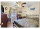 Bedroom with a wrought iron bed, vintage furniture, and natural light from the window at 2703 Phyllis St, North Charleston, SC 29405