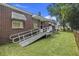 Charming home exterior with a ramp for accessibility and a well-maintained lawn at 2703 Phyllis St, North Charleston, SC 29405