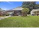 A brick home with a covered carport and a well-maintained lawn at 2703 Phyllis St, North Charleston, SC 29405