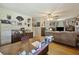 Home office and living area featuring an oversized desk, vintage decor, and a comfortable sofa at 2703 Phyllis St, North Charleston, SC 29405