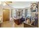 Spacious office with a large wooden desk, built-in shelving, and multiple windows providing natural light at 2703 Phyllis St, North Charleston, SC 29405