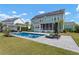 Expansive backyard with pool, sun loungers, covered patio and solar panels, perfect for luxury outdoor living at 2917 River Vista Way, Mount Pleasant, SC 29466