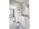 Bathroom with granite countertops, dual sinks, and decorative artwork at 2917 River Vista Way, Mount Pleasant, SC 29466