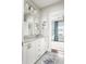Bathroom with dual sinks, granite countertops, and decorative artwork on the walls at 2917 River Vista Way, Mount Pleasant, SC 29466
