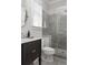 Elegant bathroom featuring a glass enclosed tiled shower, vanity, modern fixtures, and ample natural light at 2917 River Vista Way, Mount Pleasant, SC 29466