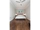 Spacious bedroom featuring hardwood floors, a ceiling fan, and a beach-themed painting above the bed at 2917 River Vista Way, Mount Pleasant, SC 29466