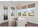 Bright breakfast nook with large windows and a modern light fixture at 2917 River Vista Way, Mount Pleasant, SC 29466