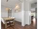 Neutral dining room featuring a decorative chandelier, farmhouse table with seating for six, and stylish artwork at 2917 River Vista Way, Mount Pleasant, SC 29466