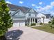 Charming two-story home with a welcoming front porch, three car garage and a long driveway at 2917 River Vista Way, Mount Pleasant, SC 29466
