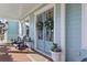 Cozy front porch with seating, seasonal decor, and a painted door at 2917 River Vista Way, Mount Pleasant, SC 29466