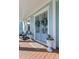 Inviting front porch with seating, seasonal decor, and a painted door at 2917 River Vista Way, Mount Pleasant, SC 29466