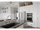 Bright kitchen island with stainless steel appliances, a stone countertop, and hardwood floors at 2917 River Vista Way, Mount Pleasant, SC 29466