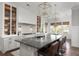 Spacious kitchen with a large island, stainless steel appliances, bar seating, and decorative pendant lighting at 2917 River Vista Way, Mount Pleasant, SC 29466