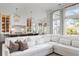 Open concept kitchen featuring stainless appliances, bar seating, and natural light from well-placed windows at 2917 River Vista Way, Mount Pleasant, SC 29466