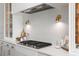 Clean kitchen featuring a marble backsplash, stainless steel range, and gold sconces at 2917 River Vista Way, Mount Pleasant, SC 29466