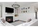 Inviting living room featuring a fireplace, large TV, and a large comfortable sectional sofa at 2917 River Vista Way, Mount Pleasant, SC 29466