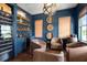 Charming living room featuring a wet bar, mini fridge, wine cooler and decorative whiskey barrel elements at 2917 River Vista Way, Mount Pleasant, SC 29466