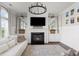 Inviting living room featuring a fireplace, large TV, and a large comfortable sectional sofa at 2917 River Vista Way, Mount Pleasant, SC 29466