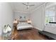 Comfortable main bedroom with a king-sized bed, hardwood floors, and plenty of natural light at 2917 River Vista Way, Mount Pleasant, SC 29466