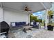 Covered outdoor living area featuring stylish seating and a ceiling fan creating a relaxing space to entertain at 2917 River Vista Way, Mount Pleasant, SC 29466