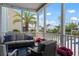 Relaxing screened porch with comfortable seating, decorative string lights, and a view at 2917 River Vista Way, Mount Pleasant, SC 29466