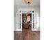 Sitting room with hardwood floors, accent wall, and french doors at 2917 River Vista Way, Mount Pleasant, SC 29466