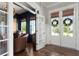 Sitting room with hardwood floors, accent wall, and french doors to the exterior at 2917 River Vista Way, Mount Pleasant, SC 29466