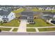 Aerial view of a charming two-story home with a landscaped front yard and attached garage at 302 Lucca Dr, Summerville, SC 29486